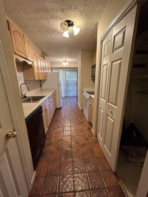 kitchen featuring white electric range, sink, dishwasher, a textured ceiling, and dark tile patterned flooring