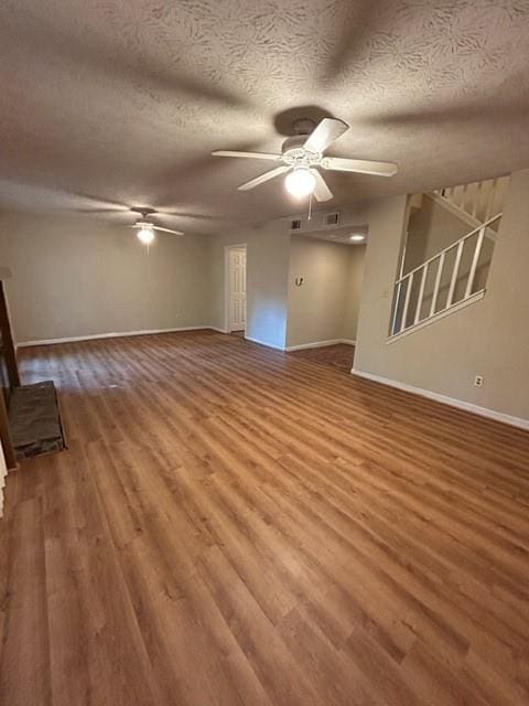 empty room featuring hardwood / wood-style floors and ceiling fan