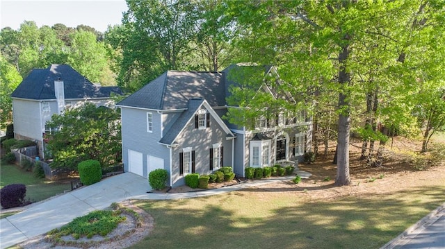 251 Waterford Cove Dr, Suwanee, GA 30024 - view of front facade featuring an attached garage, concrete driveway, and a front lawn
