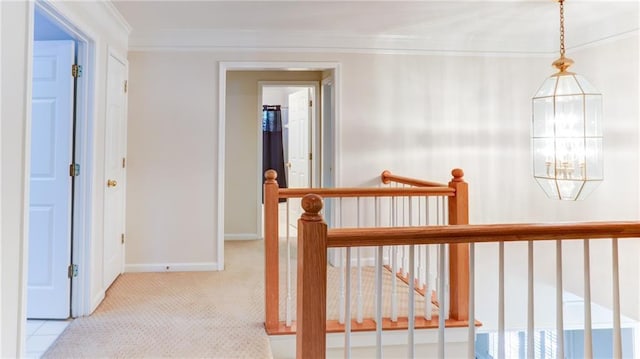 251 Waterford Cove Dr, Suwanee, GA 30024 - hall featuring ornamental molding, an upstairs landing, carpet floors, a chandelier, and baseboards