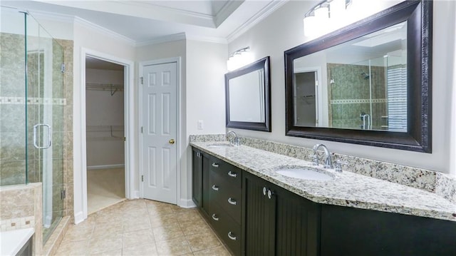251 Waterford Cove Dr, Suwanee, GA 30024 - bathroom featuring double vanity, a stall shower, ornamental molding, a spacious closet, and tile patterned floors