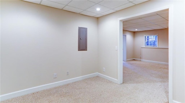 251 Waterford Cove Dr, Suwanee, GA 30024 - spare room featuring electric panel, a paneled ceiling, carpet flooring, and baseboards