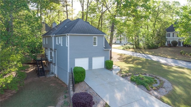 251 Waterford Cove Dr, Suwanee, GA 30024 - view of side of property with driveway, a chimney, a garage, a yard, and view of scattered trees