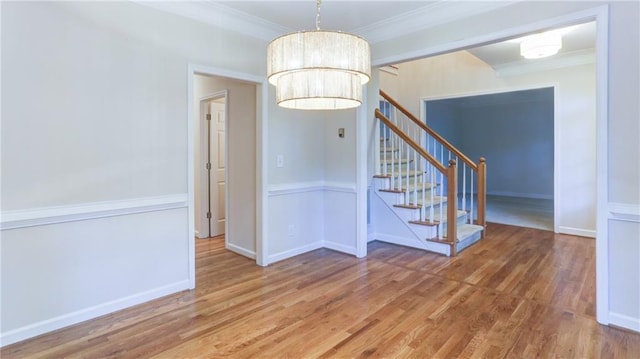 251 Waterford Cove Dr, Suwanee, GA 30024 - unfurnished dining area with wood finished floors, stairs, ornamental molding, and baseboards