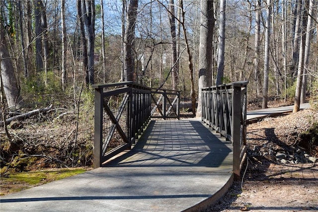 251 Waterford Cove Dr, Suwanee, GA 30024 - gate featuring a view of trees
