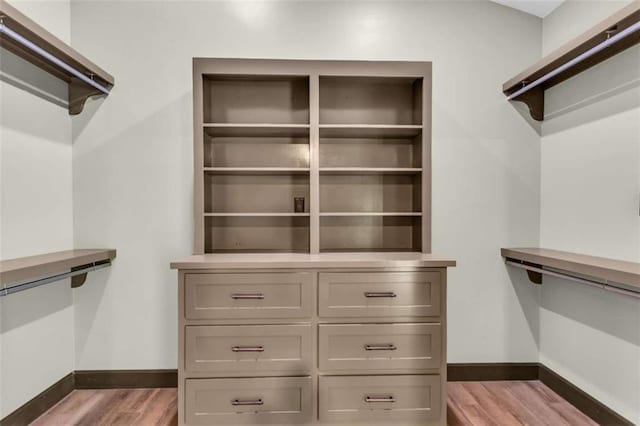 spacious closet with wood finished floors