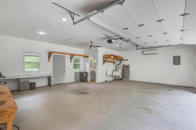 garage with electric panel, a wall mounted AC, recessed lighting, and a garage door opener