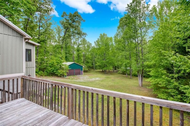 wooden terrace featuring a lawn