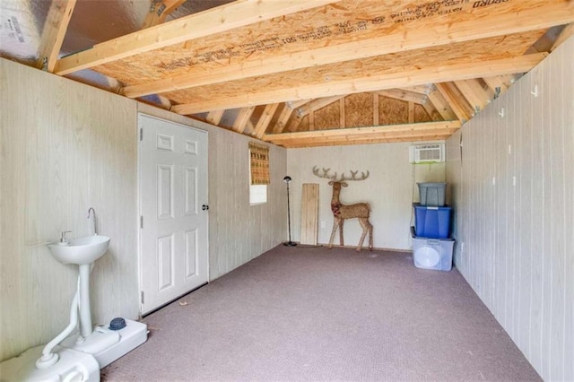 storage room with a wall mounted air conditioner