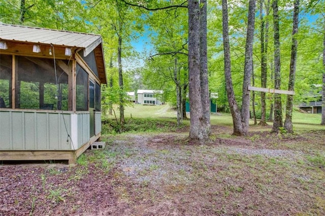 view of yard featuring a sunroom