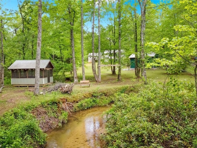 view of yard featuring a sunroom