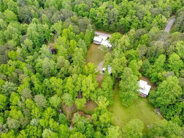 view of subject property featuring a forest