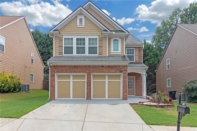 craftsman-style house featuring a front yard, central AC, and a garage