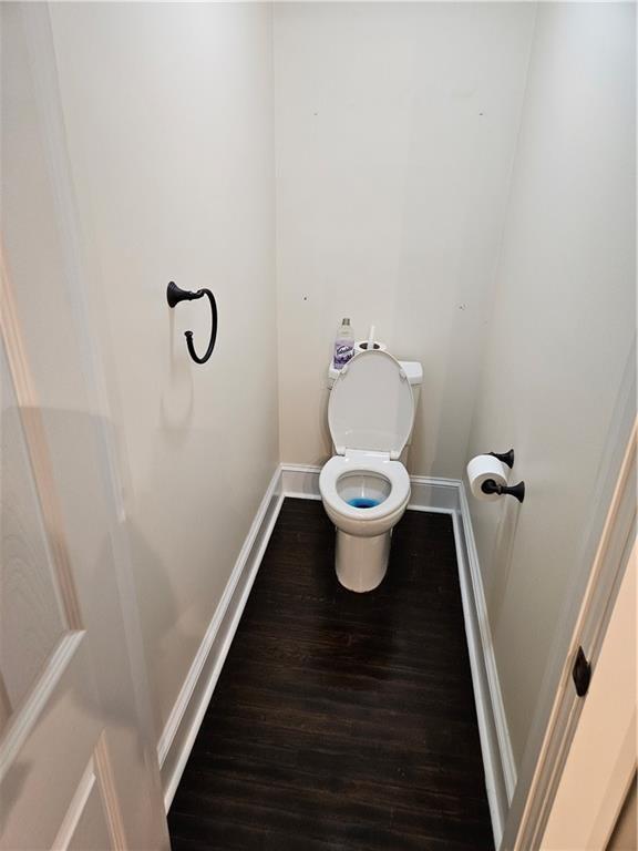 3268 Mae Ave, Brookhaven, GA 30319 - bathroom featuring toilet, baseboards, and wood finished floors