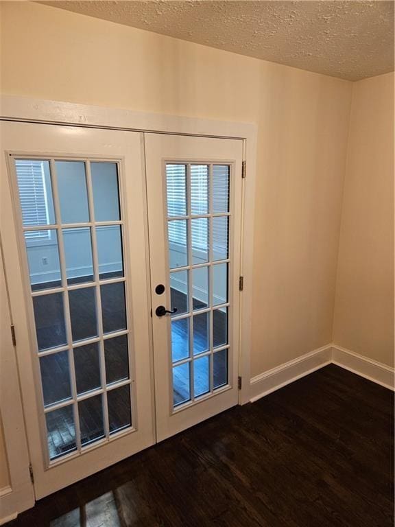 3268 Mae Ave, Brookhaven, GA 30319 - doorway to outside with baseboards, french doors, dark wood-style flooring, and a textured ceiling