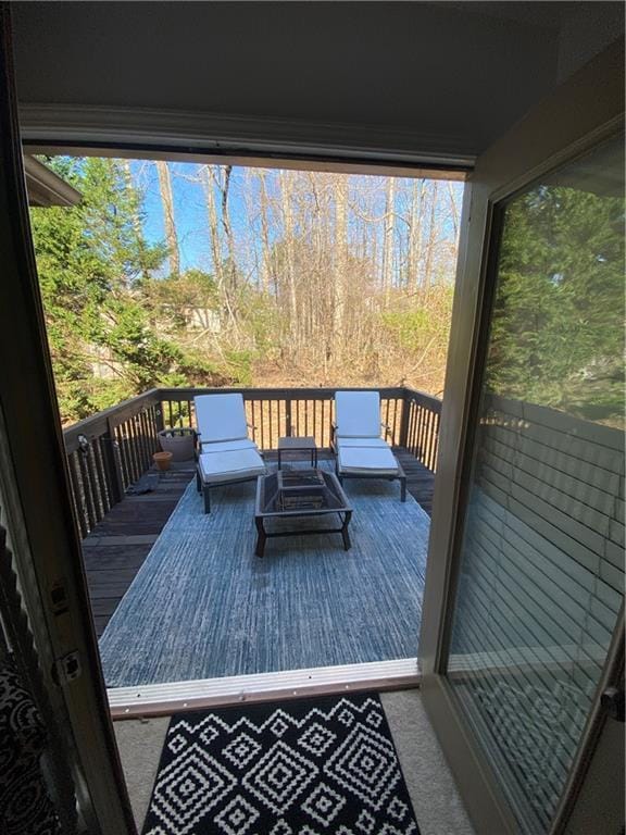 wooden deck featuring an outdoor hangout area