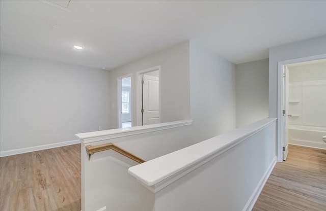 empty room with light hardwood / wood-style flooring