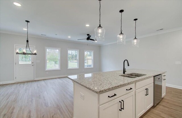 spare room with ornamental molding and light hardwood / wood-style floors