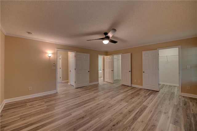 535 Toonigh Rd, Woodstock, GA 30188 - unfurnished bedroom with a textured ceiling, light wood finished floors, ornamental molding, baseboards, and a ceiling fan