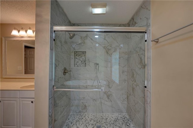 535 Toonigh Rd, Woodstock, GA 30188 - bathroom featuring a stall shower, vanity, and a textured ceiling
