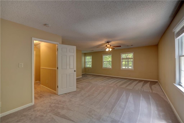 535 Toonigh Rd, Woodstock, GA 30188 - spare room featuring a ceiling fan, light colored carpet, baseboards, a textured ceiling, and a smoke detector