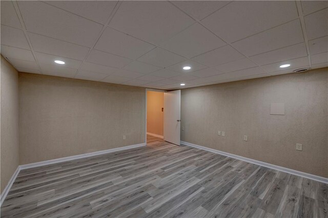 535 Toonigh Rd, Woodstock, GA 30188 - finished basement with wood finished floors, baseboards, a paneled ceiling, and recessed lighting