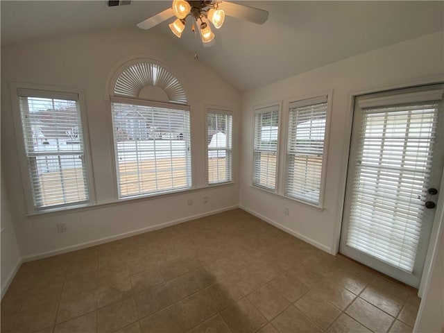 interior space featuring visible vents, lofted ceiling, baseboards, and a ceiling fan