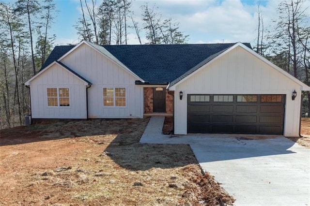 modern inspired farmhouse with driveway, a shingled roof, a garage, and board and batten siding