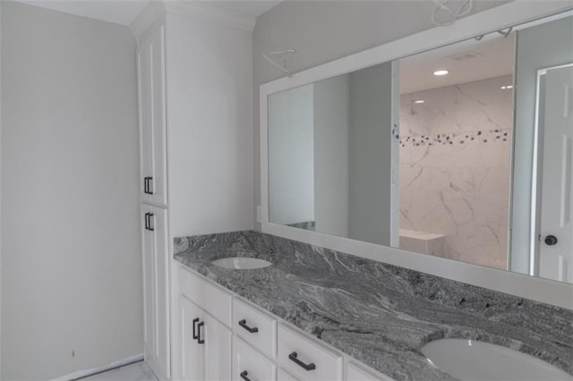 full bathroom with double vanity and a sink