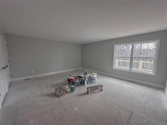 empty room featuring baseboards