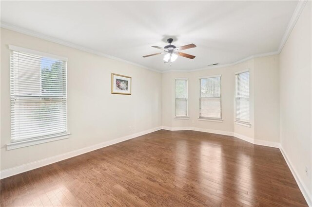 2760 Lions Gate Dr, Cumming, GA 30041 - spare room with dark wood-style floors, plenty of natural light, a ceiling fan, and ornamental molding