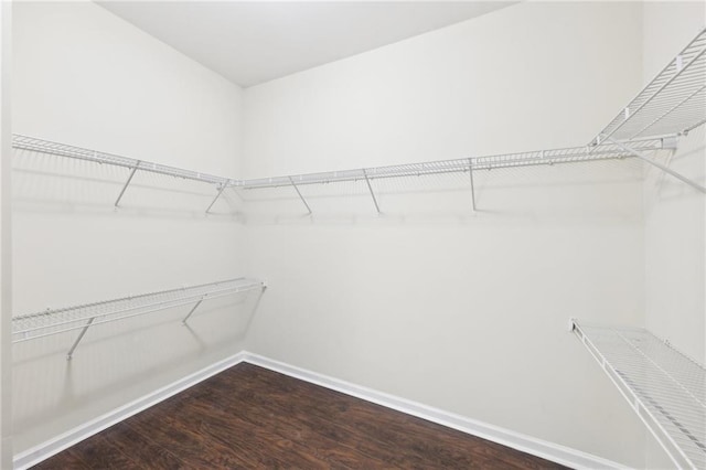 2760 Lions Gate Dr, Cumming, GA 30041 - walk in closet with wood finished floors
