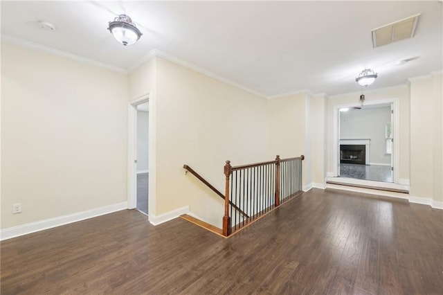 2760 Lions Gate Dr, Cumming, GA 30041 - unfurnished living room featuring wood finished floors, crown molding, baseboards, and a fireplace