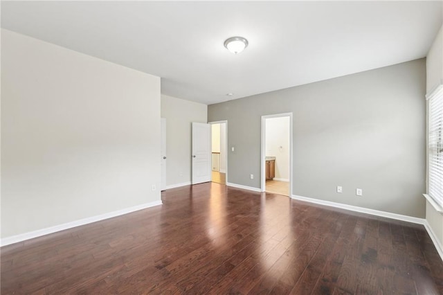 2760 Lions Gate Dr, Cumming, GA 30041 - unfurnished bedroom featuring wood finished floors, baseboards, and ensuite bathroom
