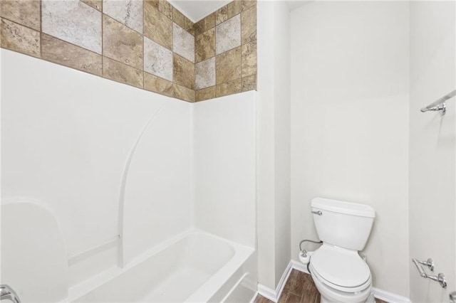 2760 Lions Gate Dr, Cumming, GA 30041 - full bathroom featuring toilet, baseboards, washtub / shower combination, and wood finished floors