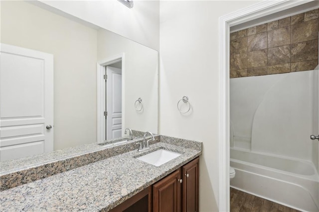 2760 Lions Gate Dr, Cumming, GA 30041 - full bathroom with vanity, toilet, wood finished floors, and bathtub / shower combination