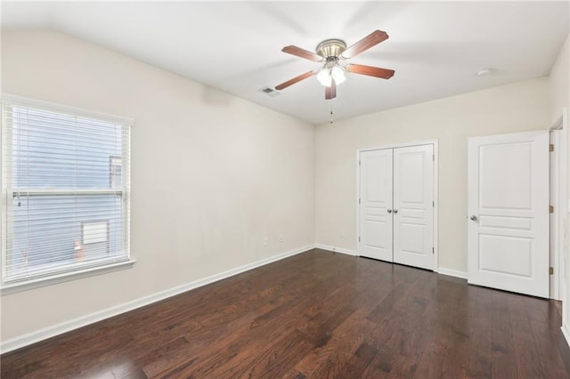 2760 Lions Gate Dr, Cumming, GA 30041 - unfurnished bedroom featuring dark wood-type flooring, baseboards, a closet, and a ceiling fan