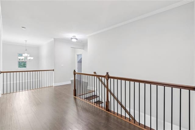 2760 Lions Gate Dr, Cumming, GA 30041 - hall with a chandelier, an upstairs landing, wood finished floors, crown molding, and baseboards