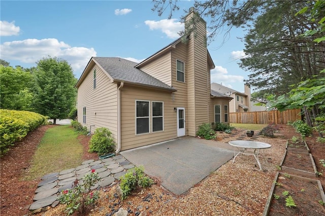 2760 Lions Gate Dr, Cumming, GA 30041 - back of house with a patio area, fence, a chimney, and roof with shingles