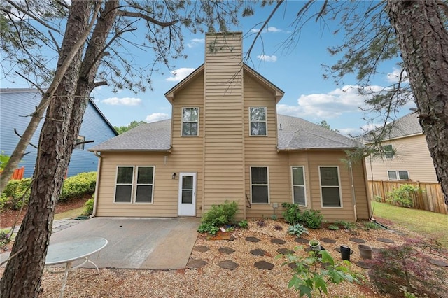 2760 Lions Gate Dr, Cumming, GA 30041 - rear view of property featuring a shingled roof, a chimney, a patio area, and fence