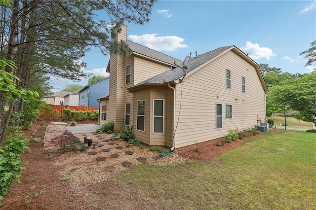 2760 Lions Gate Dr, Cumming, GA 30041 - rear view of property featuring a chimney, central AC, roof with shingles, and a patio area