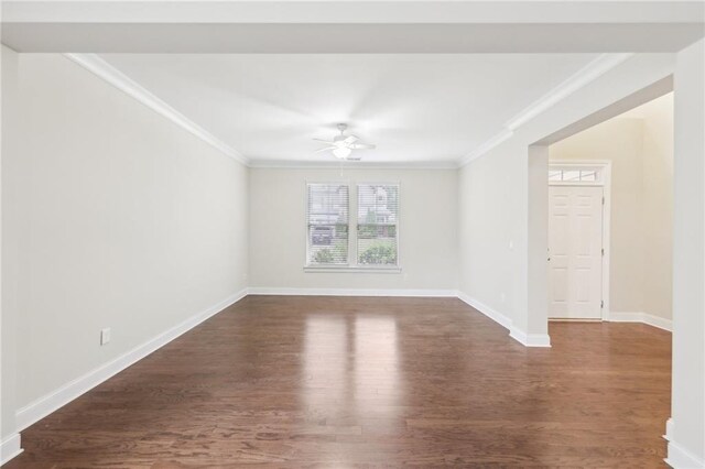 2760 Lions Gate Dr, Cumming, GA 30041 - empty room with crown molding, ceiling fan, dark wood finished floors, and baseboards