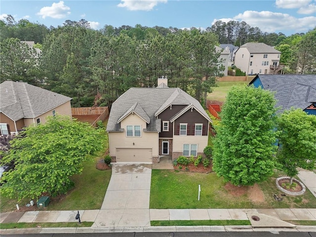 2760 Lions Gate Dr, Cumming, GA 30041 - view of front of house with an attached garage, concrete driveway, a front yard, a residential view, and a chimney