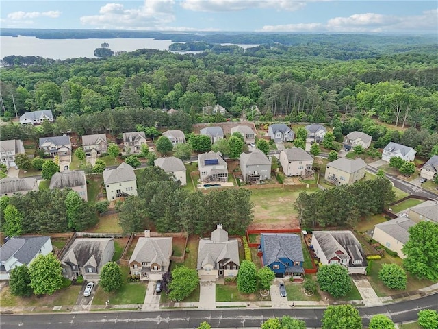 2760 Lions Gate Dr, Cumming, GA 30041 - aerial view of property and surrounding area with nearby suburban area, a forest, and a large body of water