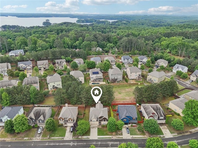 2760 Lions Gate Dr, Cumming, GA 30041 - aerial perspective of suburban area with a forest, a large body of water, and property boundaries highlighted