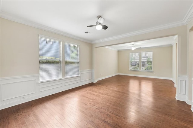 2760 Lions Gate Dr, Cumming, GA 30041 - unfurnished room featuring ceiling fan, wood finished floors, wainscoting, and crown molding