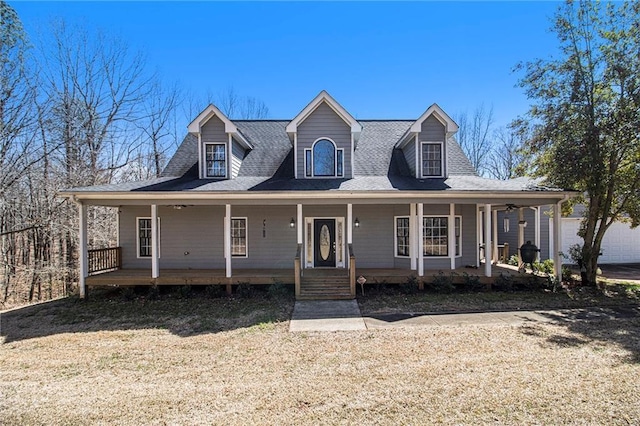 view of front of home featuring covered porch and roof with shingles