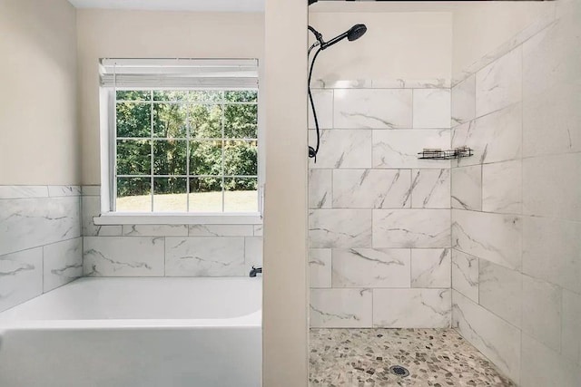 full bath featuring tiled shower and a garden tub