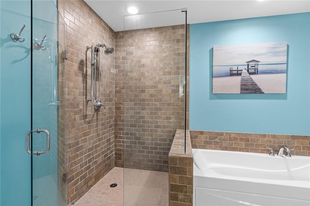 bathroom with shower with separate bathtub