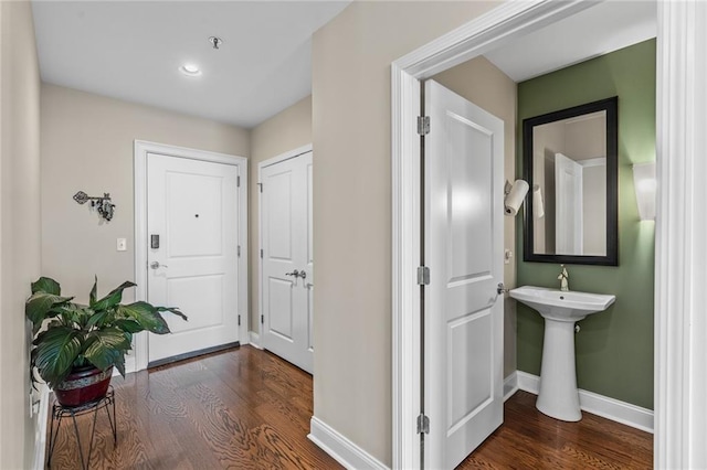 corridor with dark wood-type flooring